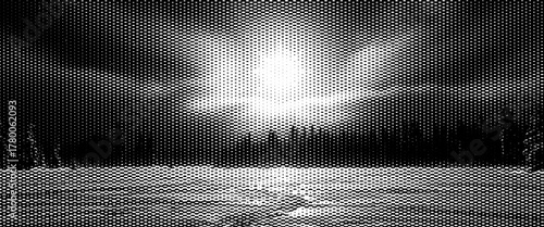 Black and white winter forest panorama with snow-covered trees and a foggy river reflection at sunrise.