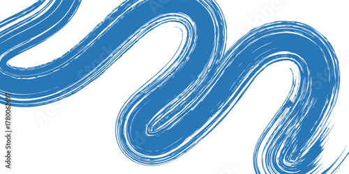 Grunge grainy blue brush stroke with spray texture. Hand drawn distress damaged vintage banner with zigzag bold line. Rough thick brush stroke texture.