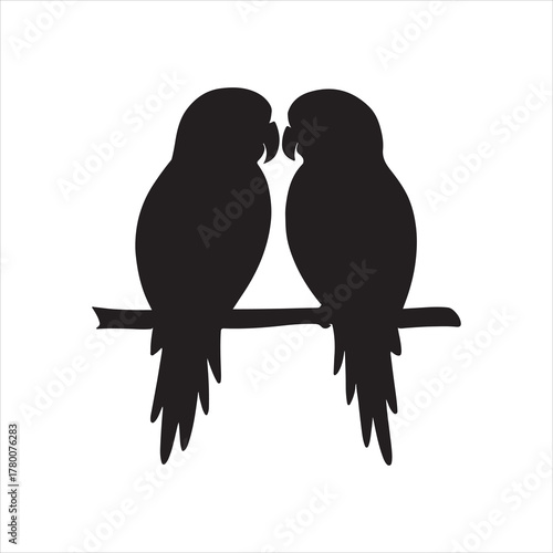 Elegant black silhouette of two parrots perched on a branch symbolizing love and companionship in minimalist graphic design against a white background
