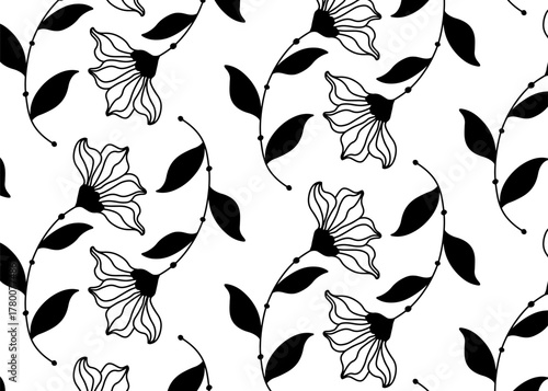 Black and white floral pattern featuring stylized flowers with detailed petals and leaves.