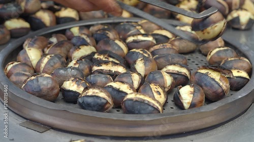 Roasted chestnuts on a street cart in autumn