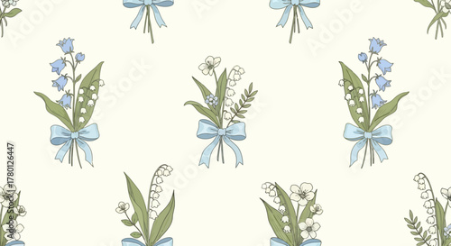 Delicate floral pattern featuring lily of the valley bouquets adorned with charming blue bows on a cream background