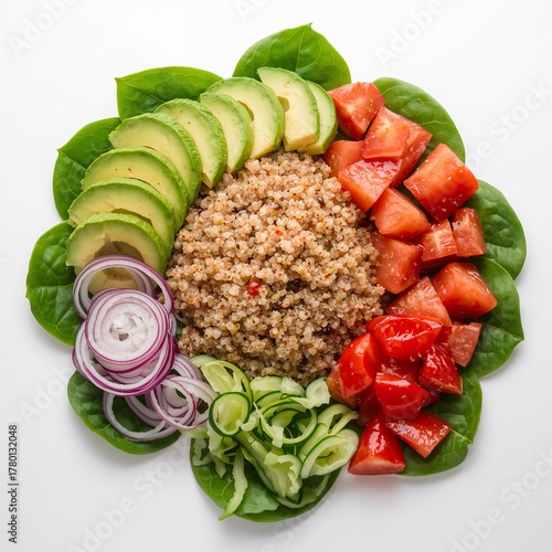 Colorful quinoa salad with avocado, tomato, cucumber, and spinach isolated on white background