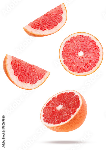dynamic studio shot of fresh red grapefruit slices and halves floating or flying in motion against a transparent background, high speed photography.