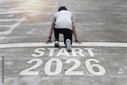 Wallpaper Mural Man ready to start new journey on start line 2026 symbolizing fresh beginning motivation and success Torontodigital.ca