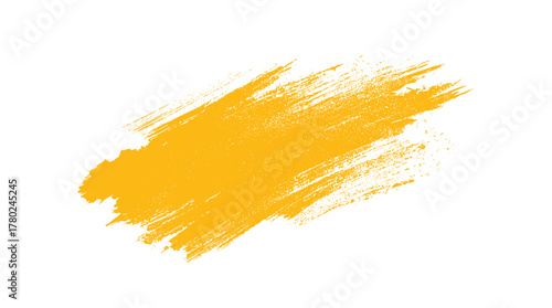 Textured yellow brush stroke with rough edges and scattered dots on a white background paint