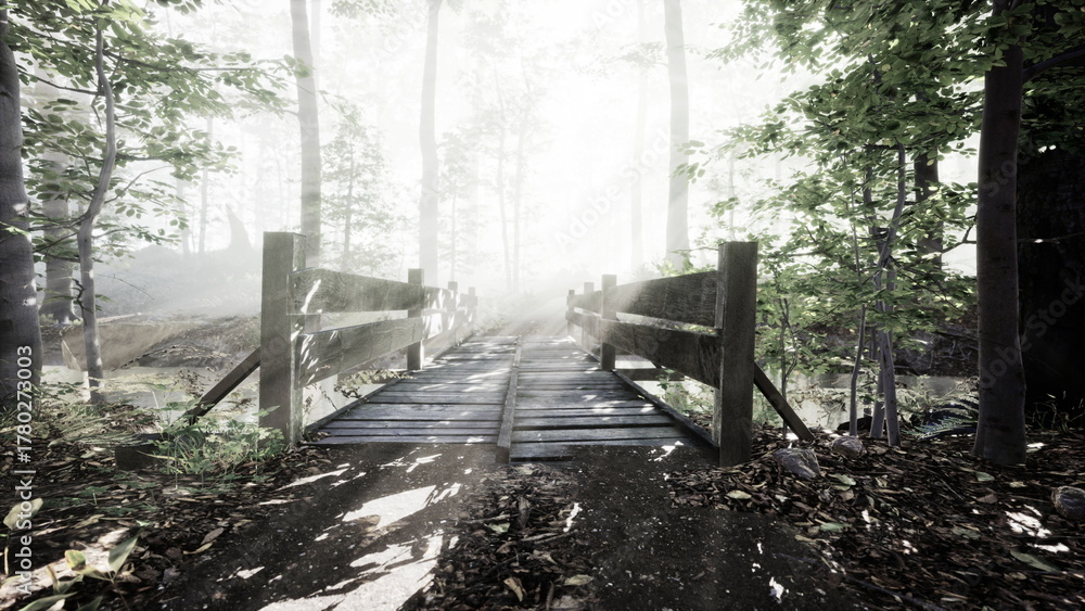 Naklejka premium Soft light filters through the trees as mist lingers in the air, revealing a charming wooden bridge. Natures tranquility invites exploration of this beautiful forest path.