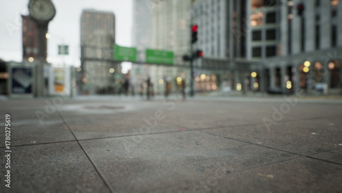 Tableau sur toile Rain soaked pavement reflects the bustle of city life as people walk by