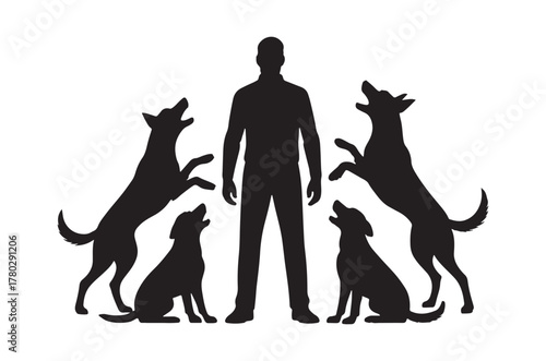 A man silhouetted with four dogs standing and sitting around him