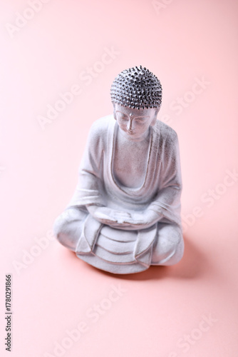 Meditating Buddha Statue on bright background. Soft focus. Copy space	