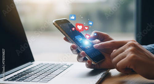 Person Using Mobile Phone at Desk