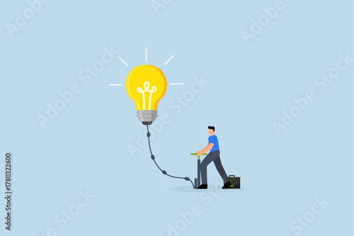 Create new idea, entrepreneur inflate air into large lightbulb concept.