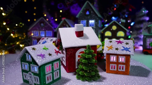 In front of the big Christmas town, a small Christmas town is spinning