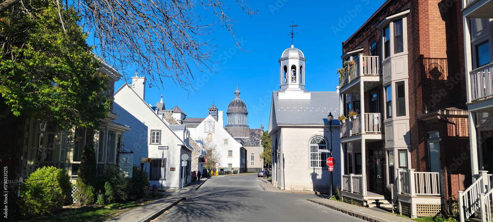 Naklejka premium Rue des Ursuline, the oldest street in Trois-Rivières city and Musée des Ursulines dome, Quebec, Canada
