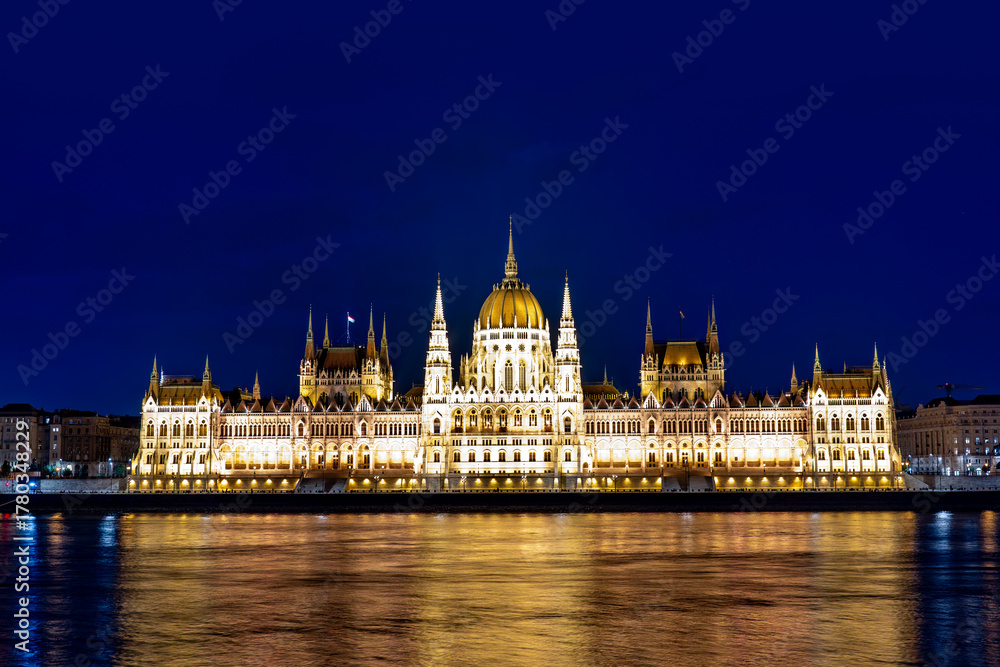 Fototapeta premium Panorama of Budapest with Danube and Parliament at night. Gothic architectural in Budapest. Historic landmark and national symbol of Budapest on Danube. Night in Budapest.