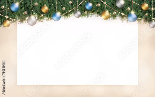 キラキラ光り輝くクリスマスの飾りと、白のボードとベージュ色の横長のぼかし背景
