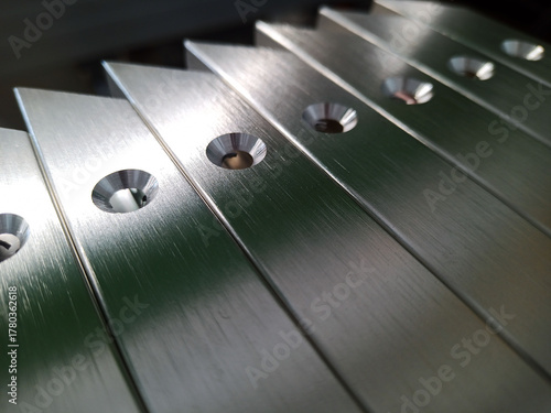 Details of furniture facades with an aluminum frame with countersunk holes. Silver color