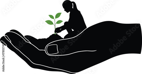 Silhouette of person planting seedling in cupped hands 1