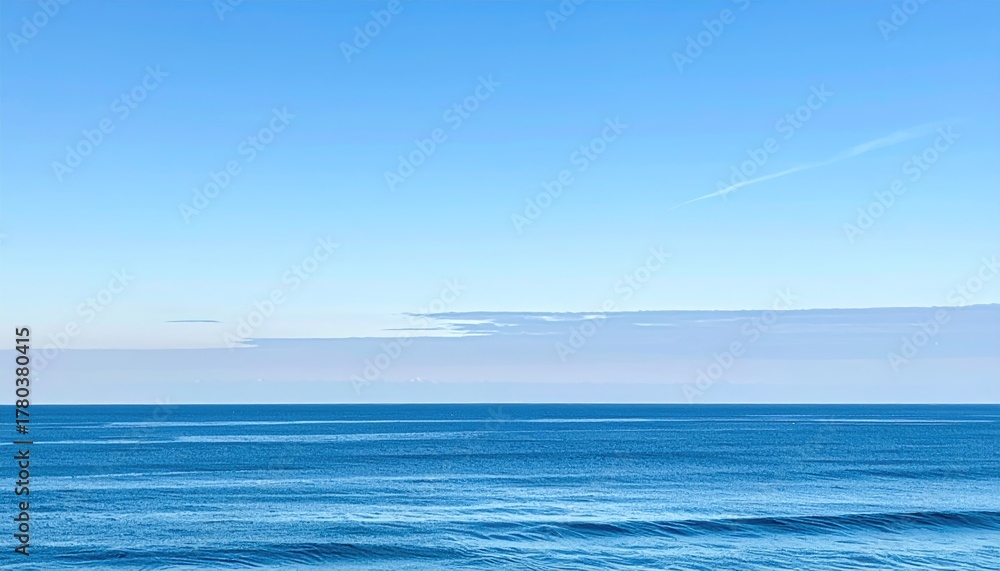 Obraz premium Clear Turquoise Sea Texture With Sun Rays Filtering Through Surface Underwater View With Blue Sky Above And Distant Contrail