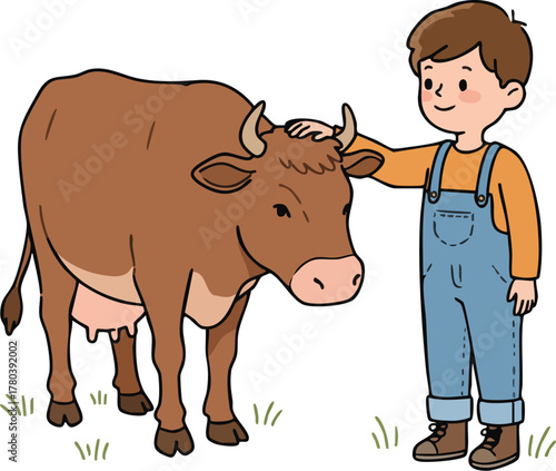 A young boy pets a brown cow standing in a field with green grass.