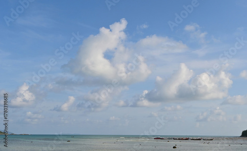 A beautiful cloudy vast sky summer landscape at the beach in Phuket, Thailand.