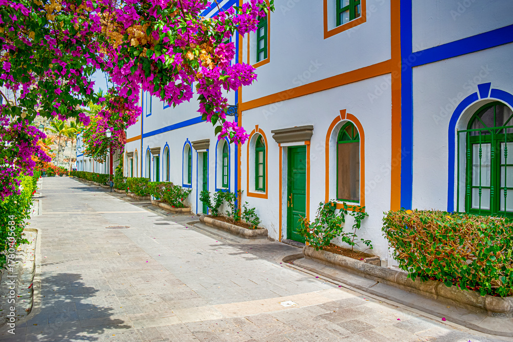 Naklejka premium Travel Concepts. Alley of Village in The Area of Puerto de Mogan at Daytime at Gran Canaria in Spain Called a Little Venice of the Canaries.