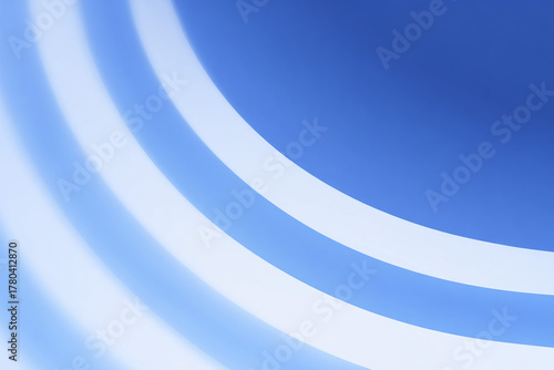 Abstract blue and white diagonal rounded lines background