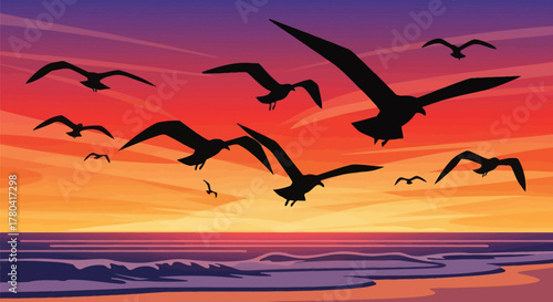 Silhouette of Seagulls Flying Over the Ocean and Beach at a Vibrant Sunset or Sunrise