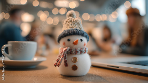 Office celebration. Snowman on desk symbolizing holiday happiness.