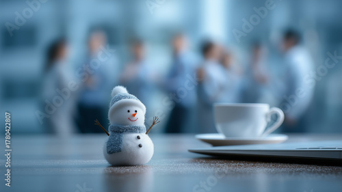 New year joy at work. Snowman on office desk and joyful staff.