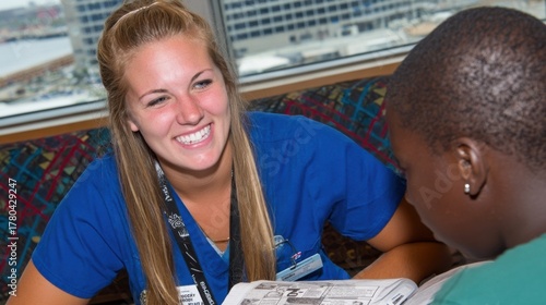 Dedicated Volunteer Tutor Assisting Young Student with Homework and Reading Skills