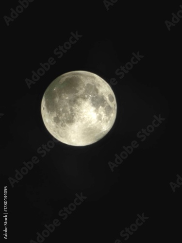 full moon over blue sky