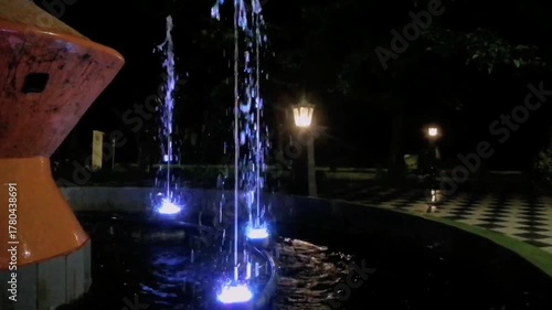 Night view fountain with illumination in the colors of the light. 