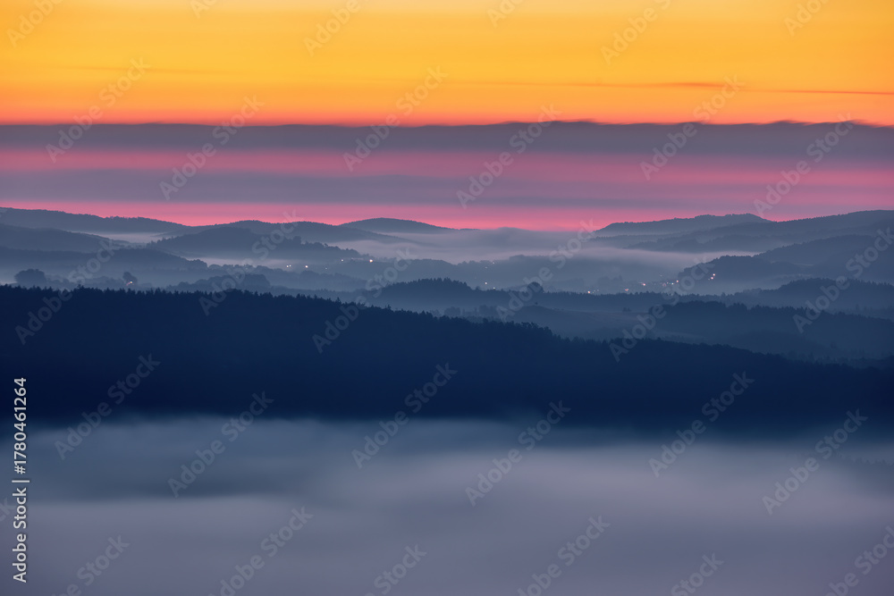 Fototapeta premium Sächsische Schweiz, Germany autumn landscape. Travel in Europe. Misty foggy morning sunride in nature. Rock hills with trees and forest.