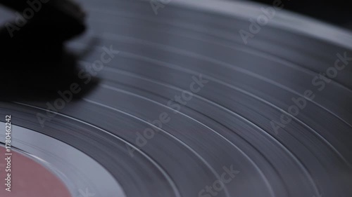 Macro Shot of Vinyl Record Spinning on Turntable with Needle Gliding on Grooves, Retro Audio Vibes, Classic Music Detail