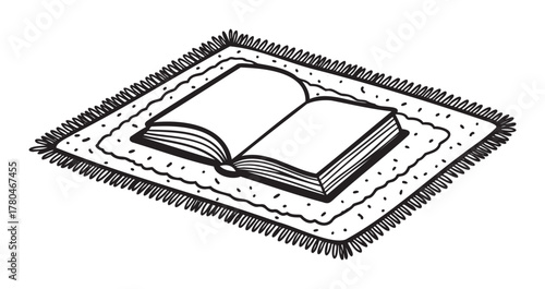 Black outline drawing of an open book resting on a rectangular mat with decorative fringes and patterns.