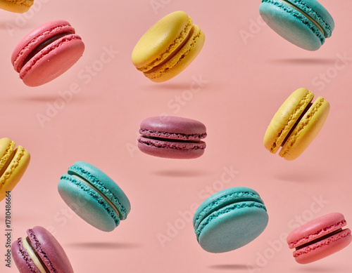 Wallpaper Mural Colorful French Macarons Floating Against a Pastel Coral Background Torontodigital.ca
