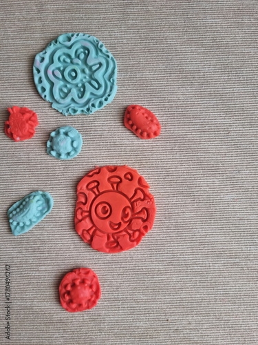 Covid and other respiratory virus molecules made of plasticine. Little toddler education moment in a playful mode. Bacteria made of playdough.