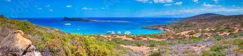 Travel Concepts. Blue Lagoon on Crete Island of Elounda with Three Cruise Liners Moored at Pier