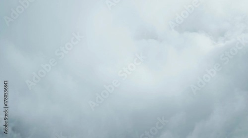 Blue sky and white clouds with light fog and dark texture cloudscape showing weather in nature
