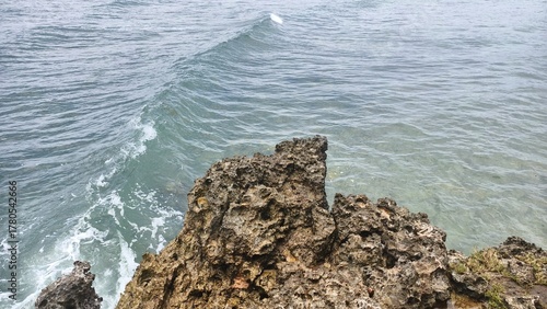 Ocean Waves Crashing Against a Rugged Coastal Cliff