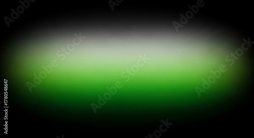 Abstract gradient background with soft transitions from black to light grey and vibrant green, creating a blurred, ethereal effect.