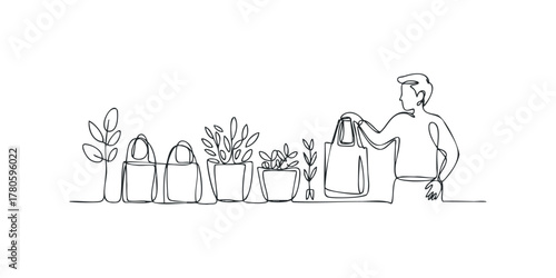 Person holding bag near potted plants