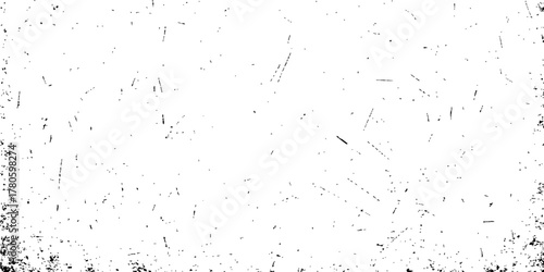 Abstract black ink splash texture on a vintage dirty paper surface creating a grunge pattern