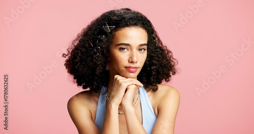 Portrait, woman and confident for beauty in studio with cosmetics, natural glow and makeover. Space, gen z and female person with makeup, cosmetology and facial shine for aesthetic on pink background