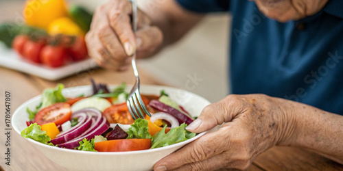 Elderly and eating vegetable salads for good health and choosing foods that are beneficial for the body