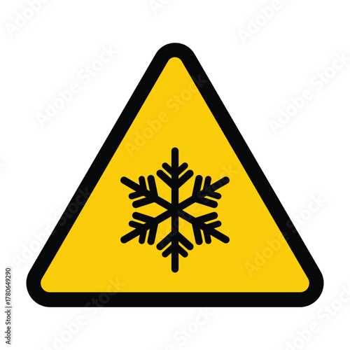 Warning sign: A black snowflake icon centered in a yellow triangle with a thick black border. This vector symbol warns of ice, frost, low temperature, or freezing road conditions. Bold, high-contrast 