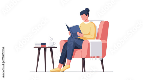 Woman enjoying quiet time reading a book in a comfortable armchair.