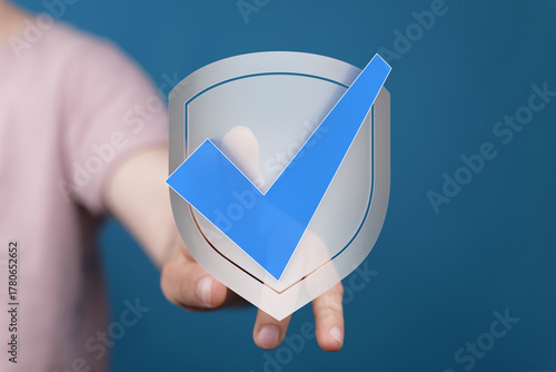A hand placing a blue check...