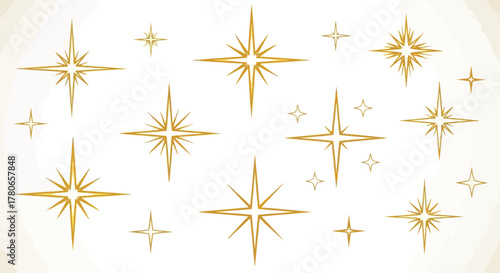 Set of golden starbursts and sparkles on a light background, shimmering and bright decorative elements
